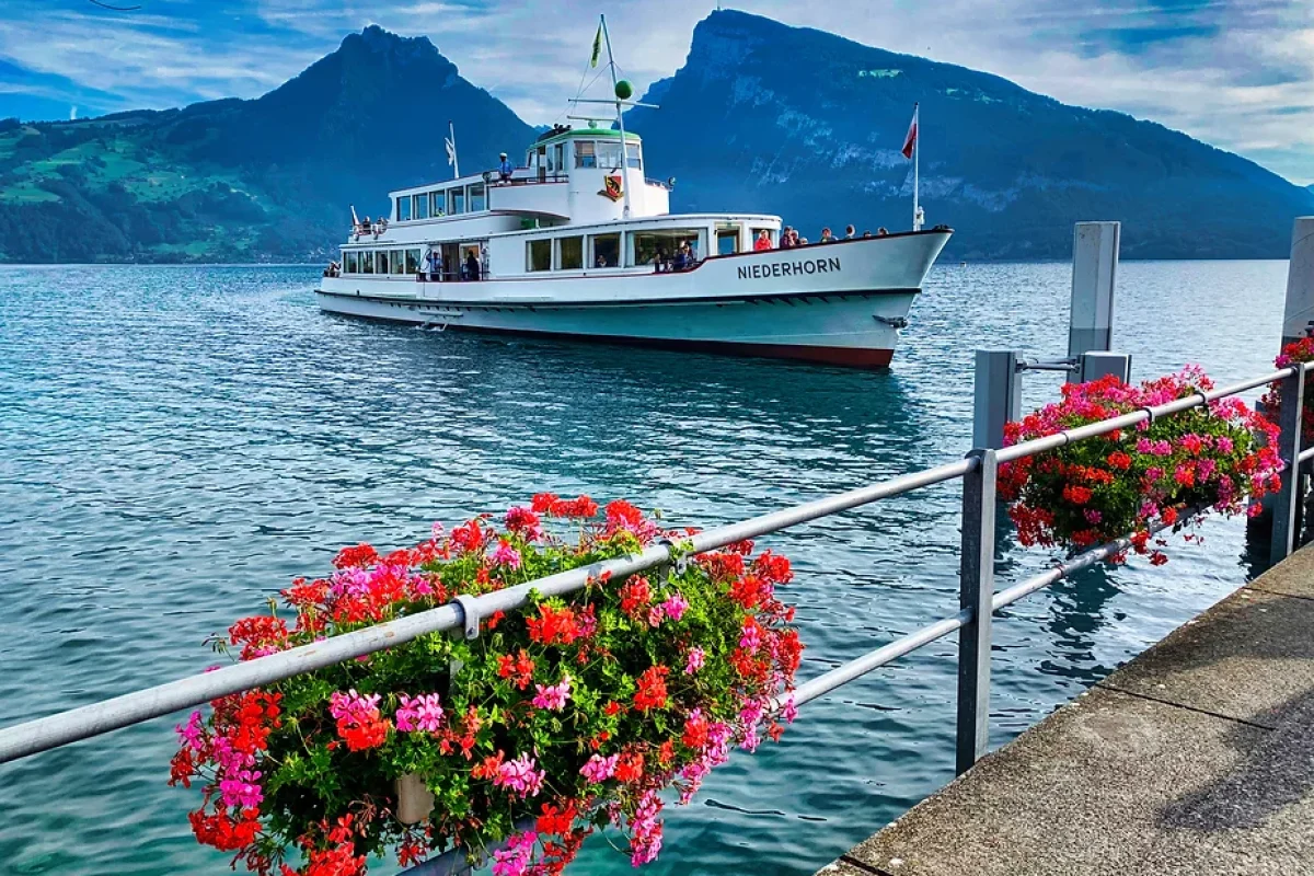 Niederhorn: Soaring above the clouds with panoramic views of the Swiss Alps and serene Lake Thun below!